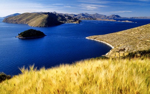 Titicaca - famous mountain lake in Andes; unique floating islands; ancient traditions of Uros Indians; reed canoes and huts.